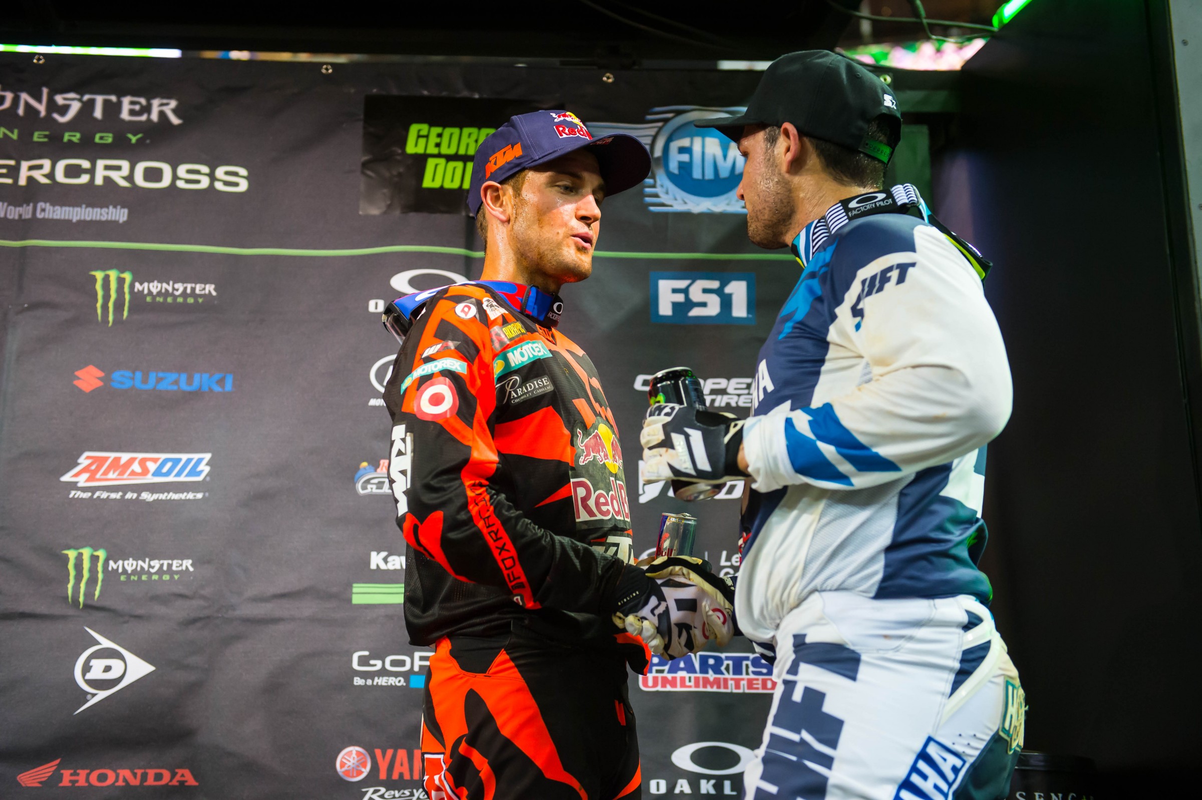 Ryan Dungey and Chad Reed talk on the podium.