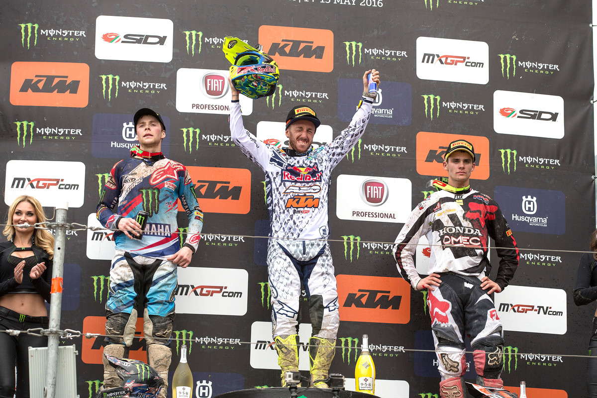 Cairoli (center) celebrates a win at his home GP.