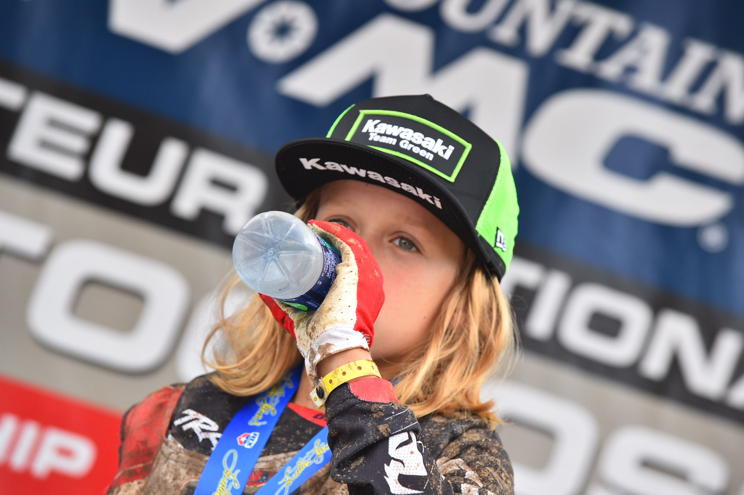 Ryder D takes sips of water following a moto win.