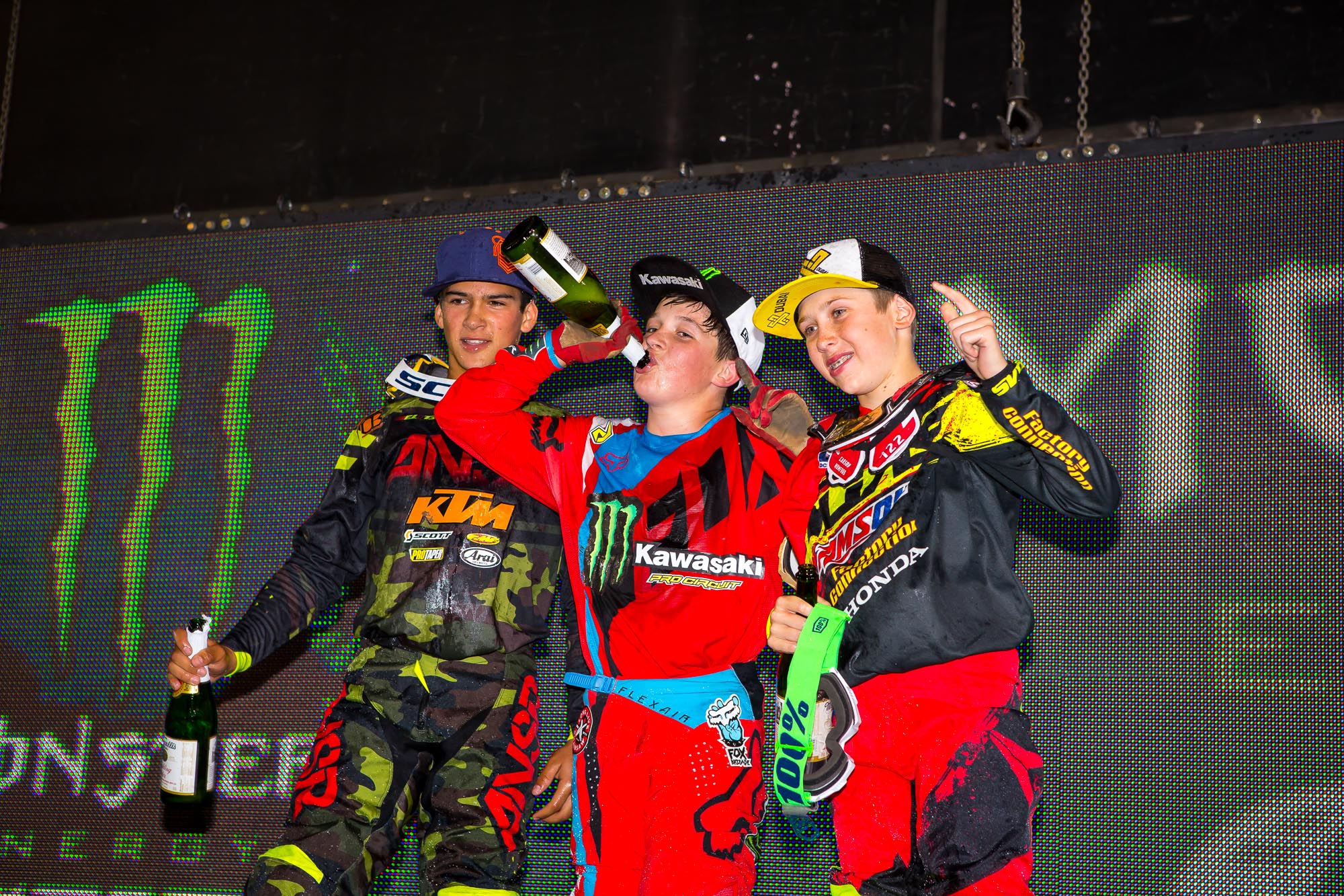 Don't worry, there's no alcohol in that bubbly! Nice rides from Aiden Tijero, left, Stilez Robertson, middle, and Carson Mumford, right.