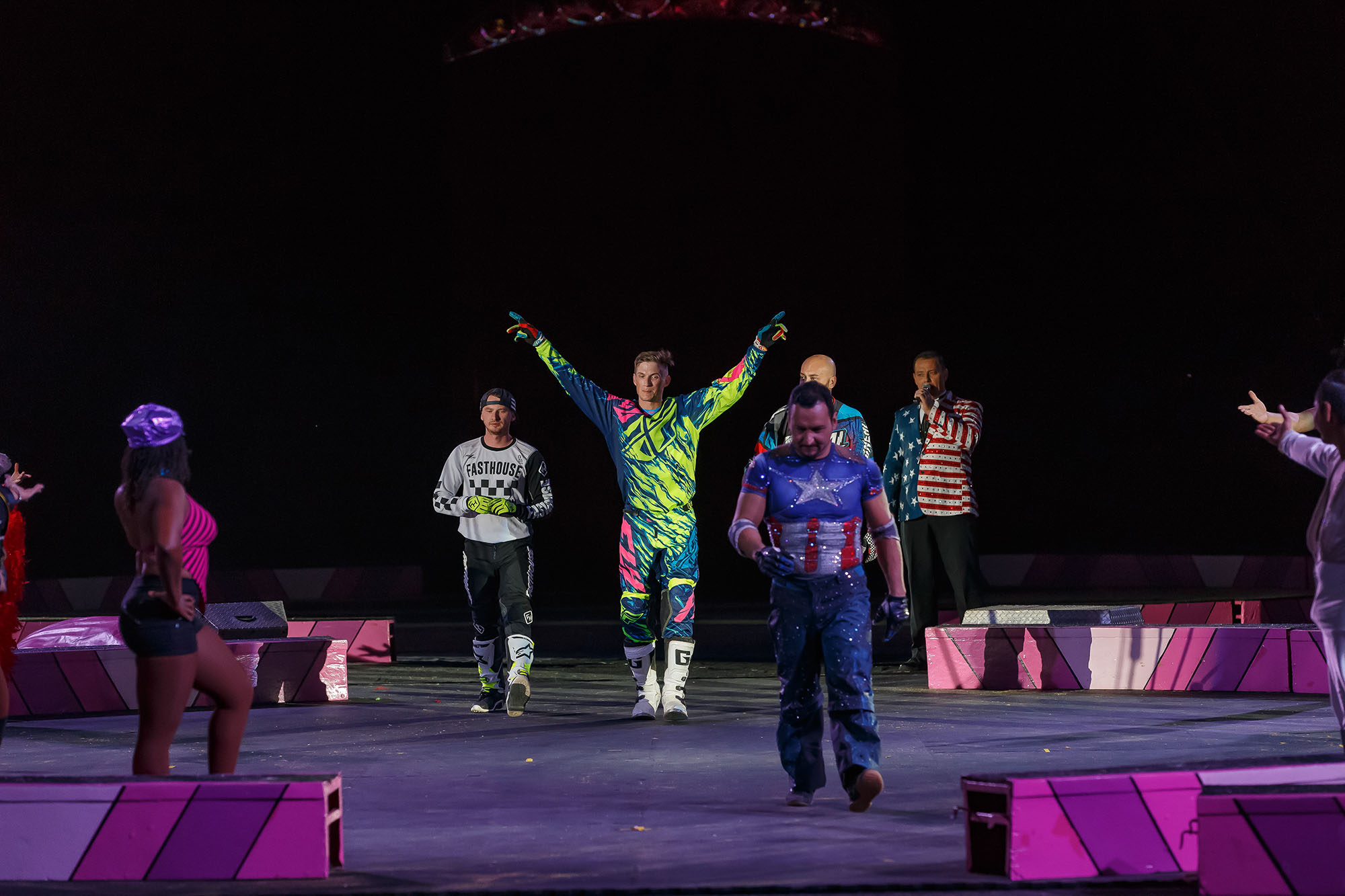 Knox (middle) gets the crowd pumped up for the show.