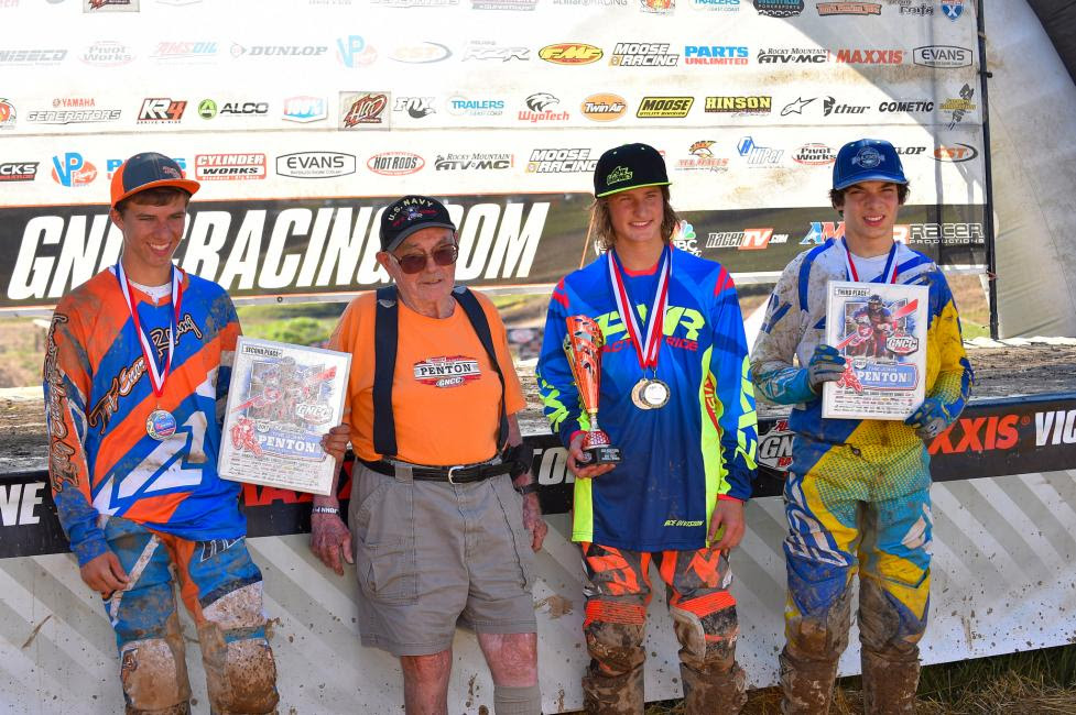 John Penton pictured with the youth overall podium: Zack Davidson, Peyton Whipkey, and Mack Riemer.