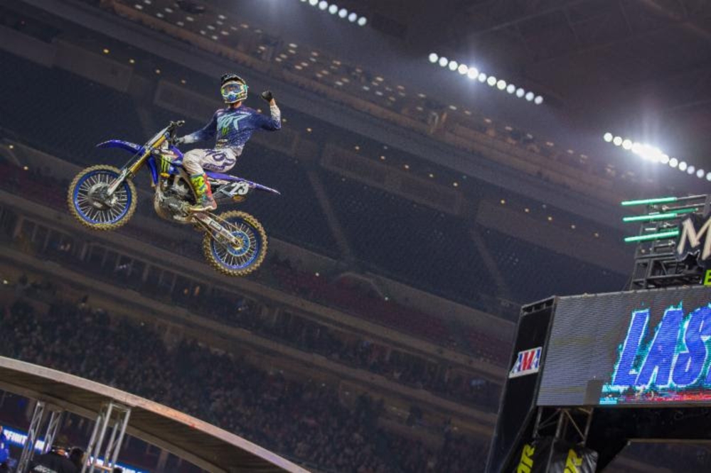 Plessinger shakes his fist at the idiots in the managers' tower as he sails across the finish line jump.