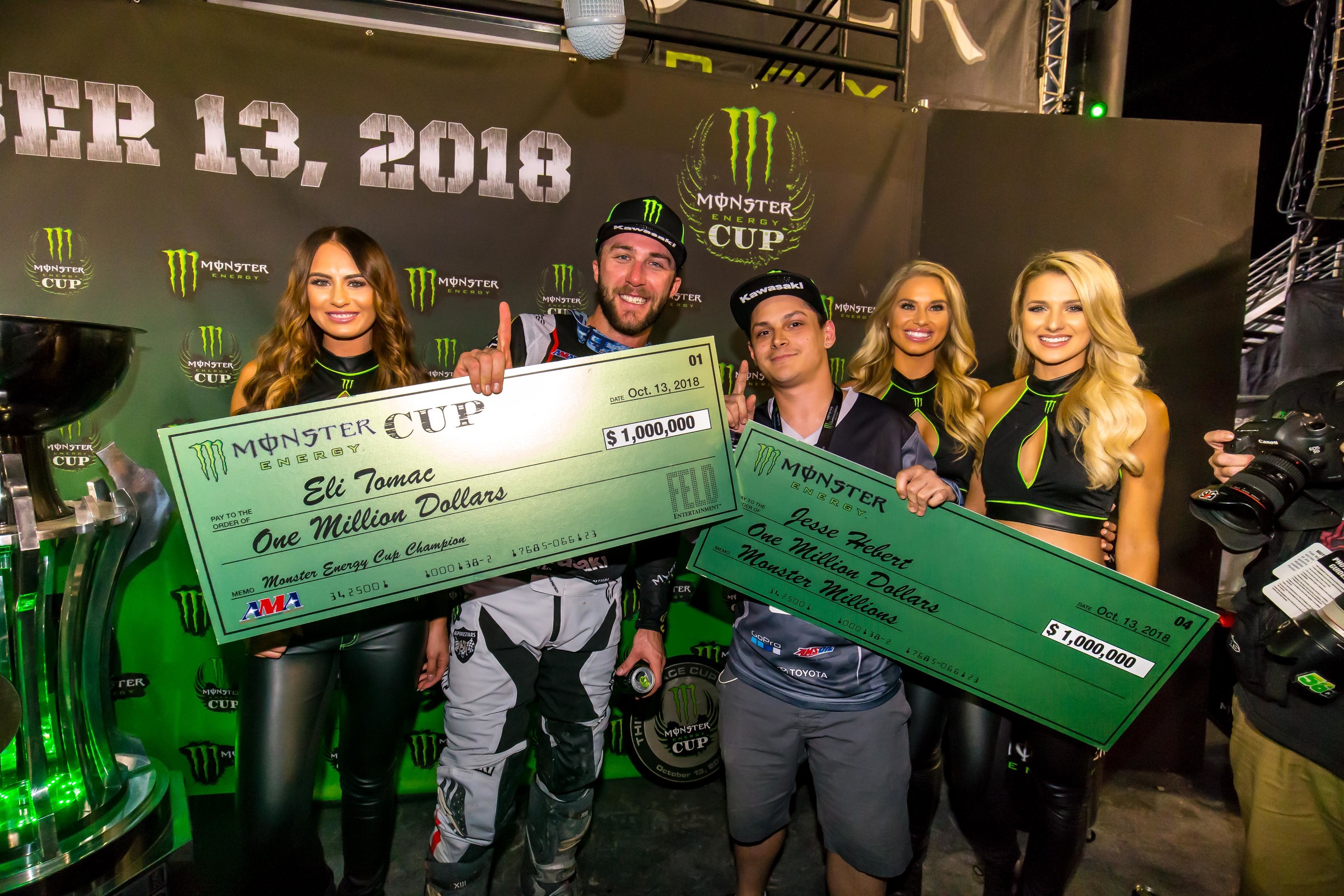 Tomac and fan sweepstakes winner Jesse Hebert, both with million-dollar checks.