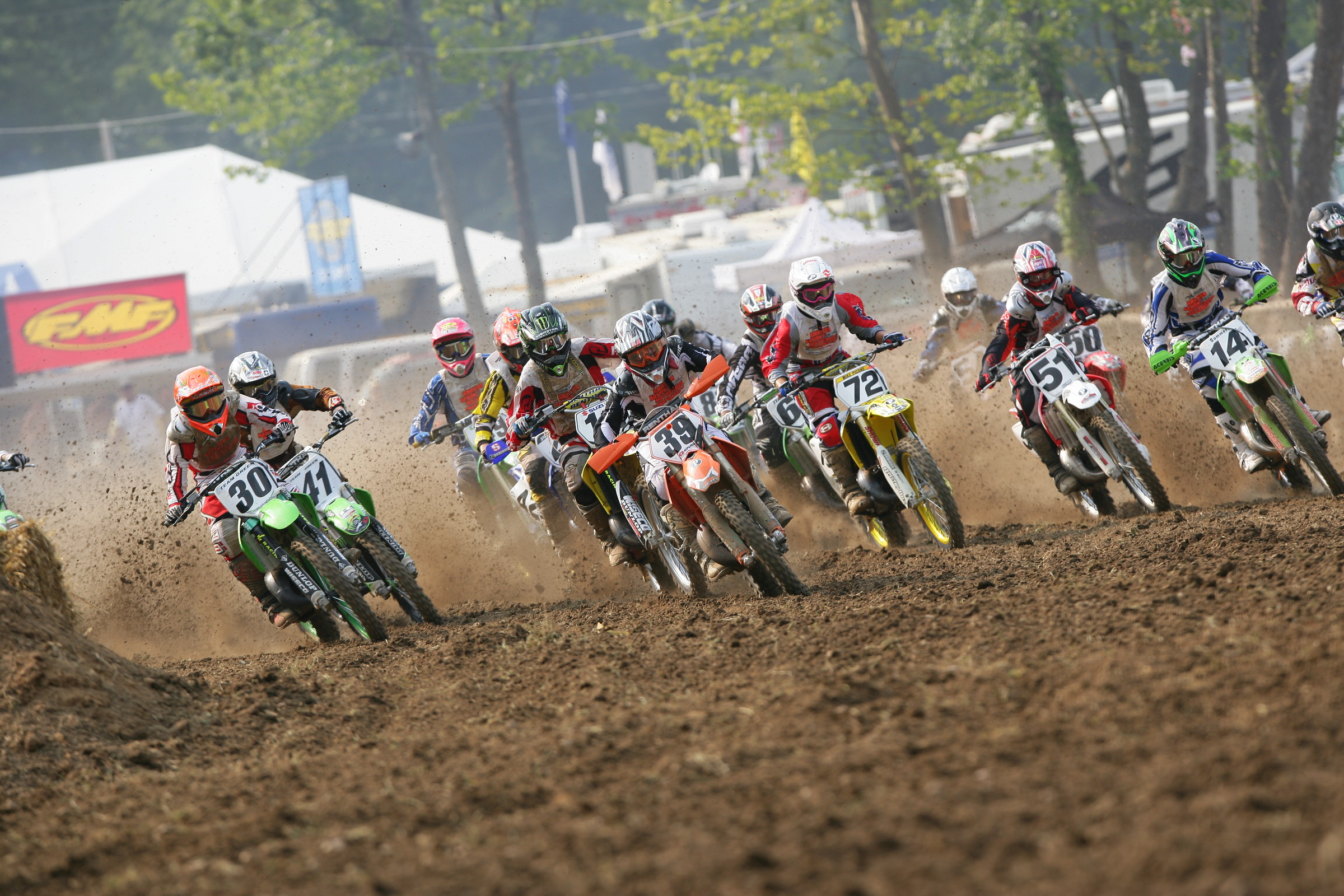 Zach Osborne (#39) leading the 125cc (12-15) Stock class through the first turn at the Loretta Lynn Ranch.