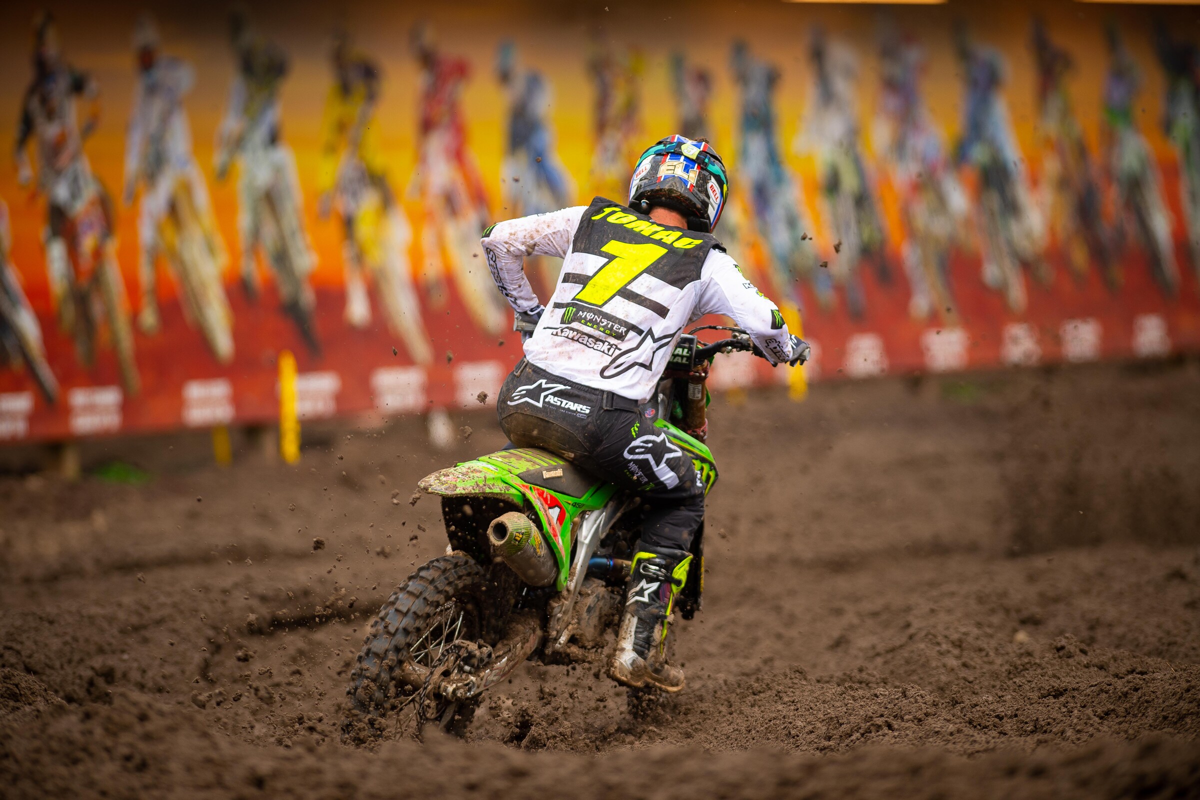 Tomac passing the billboard at the Ranch.