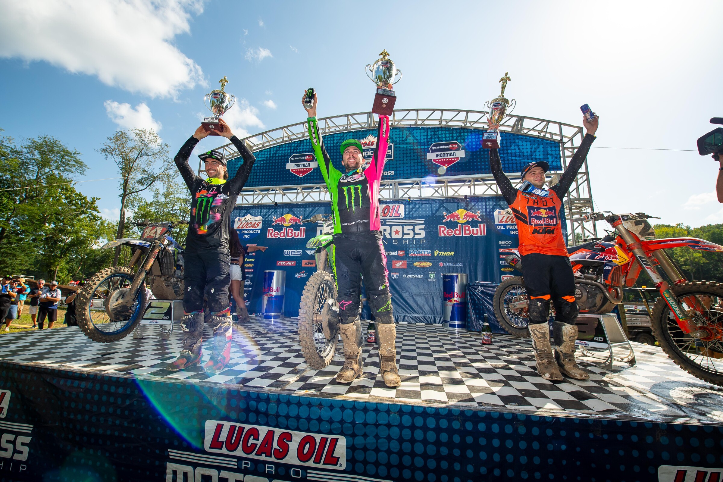 The 2021 Ironman National 450 Class overall podium: Eli Tomac (middle, 2-1 for first overall), Dylan Ferrandis, left (1-2 for second overall), and Cooper Webb (right, 4-3 for third overall).