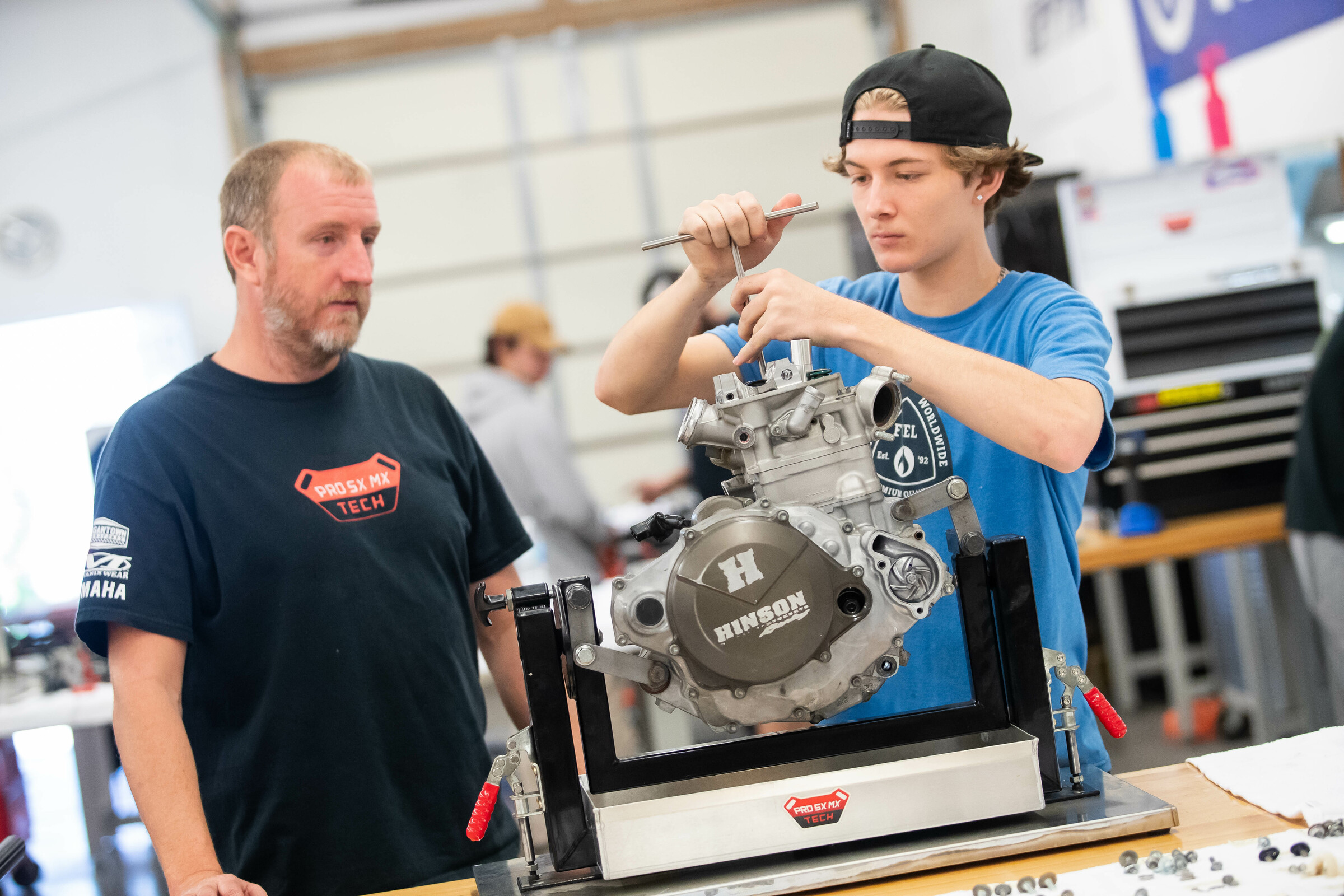 Adkins watches as one of his students works.