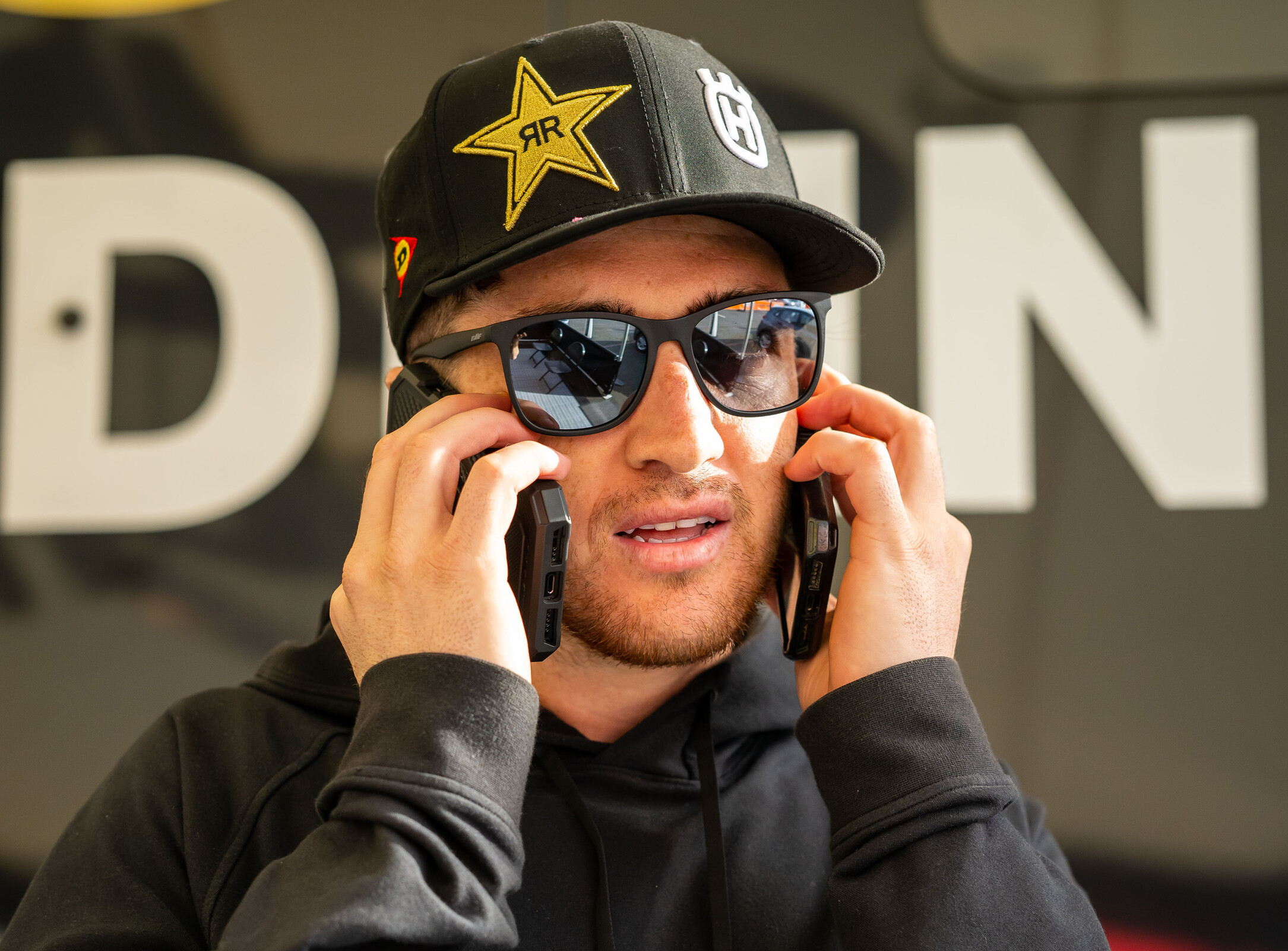 Dean Wilson working the phones for Rockstar Husqvarna.