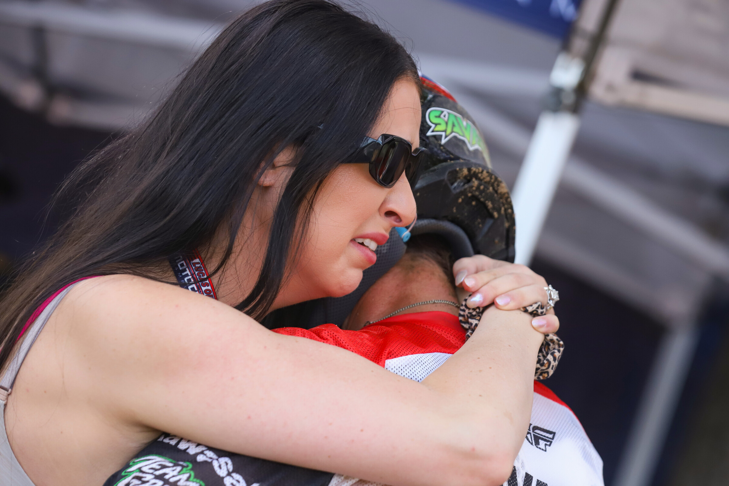 Megan Savatgy gets emotional as she hugs her husband Joey following his third-place finish.