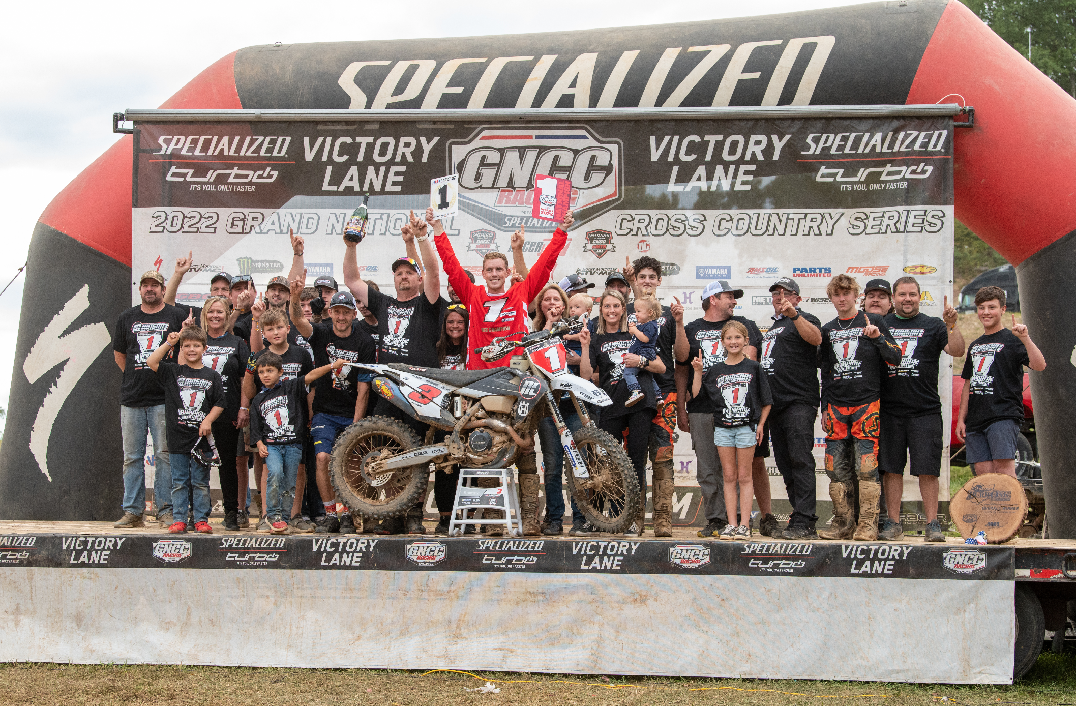 Jordan Ashburn and the Magna 1 Motorsports Off-Road Racing Team celebrating.