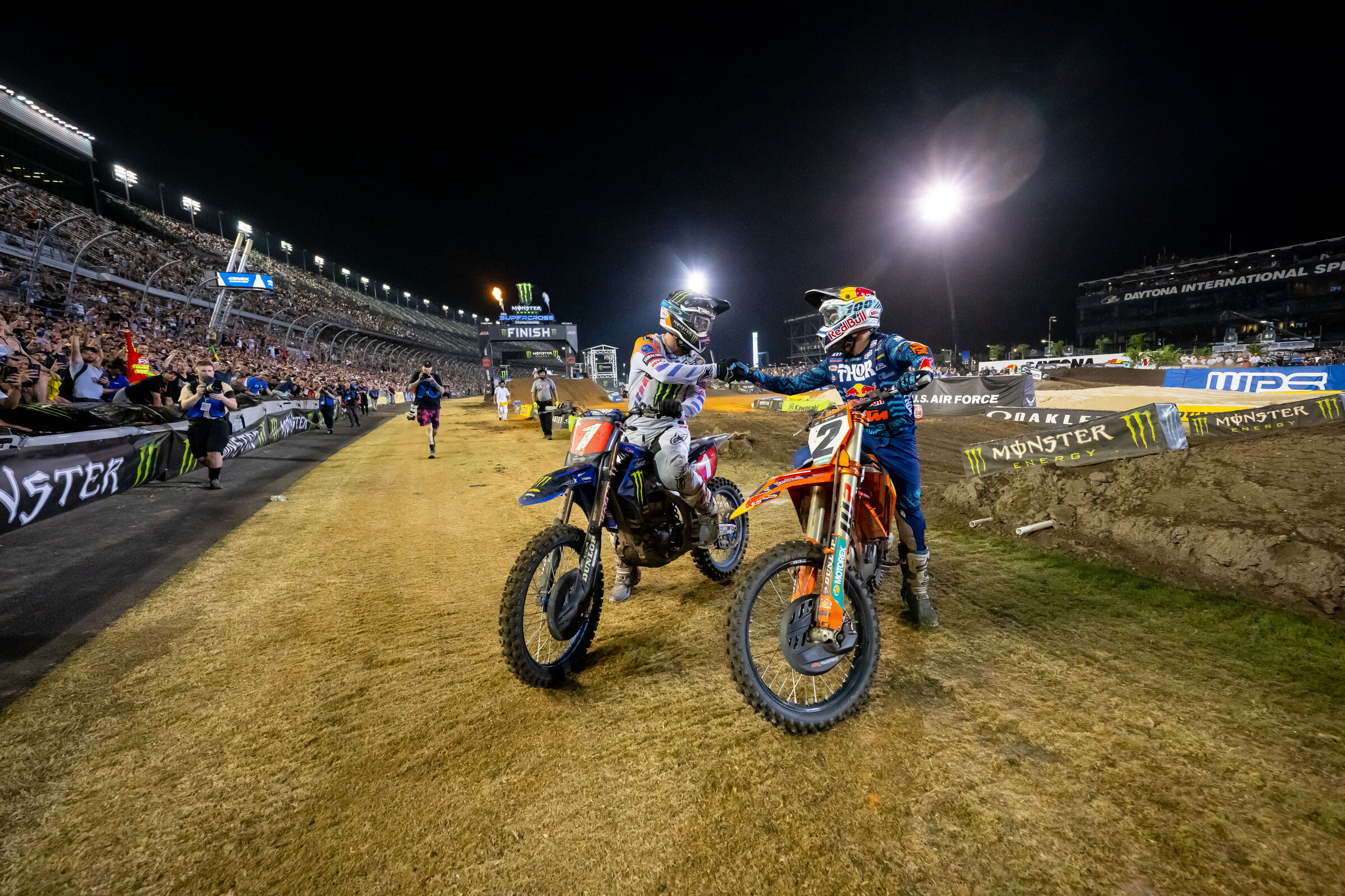 Tomac and Webb show respect following a tense race.
