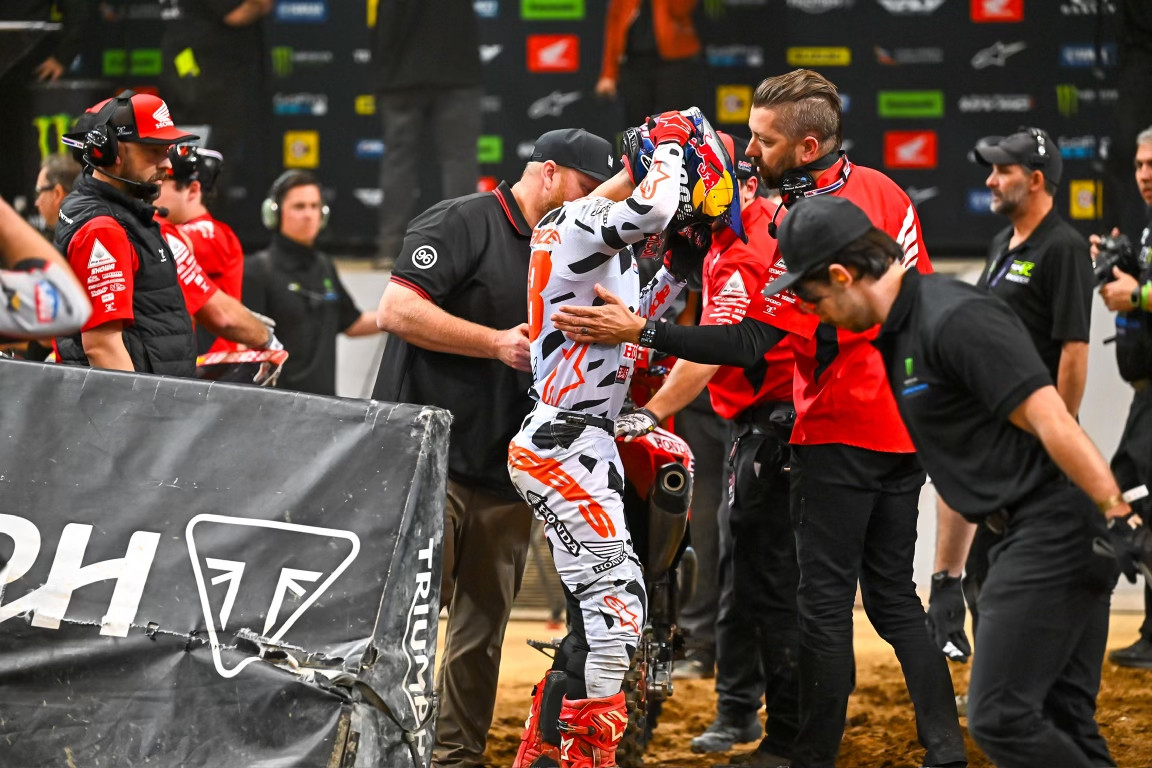 Jett Lawrence is tended to by the Honda HRC team after the race.