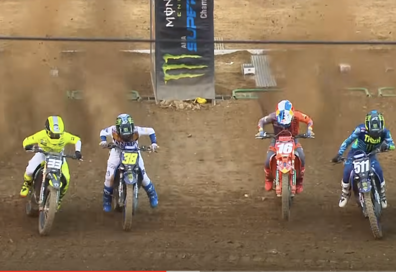 Deegan's jump was okay, but a crooked rut out of the gate allowed Swoll (33) to start getting an elbow ahead. He then dove toward the inside, in front of Deegan. On the other side, Tom Vialle (16) got a bad jump, and Nick Romano (511) shut him off.