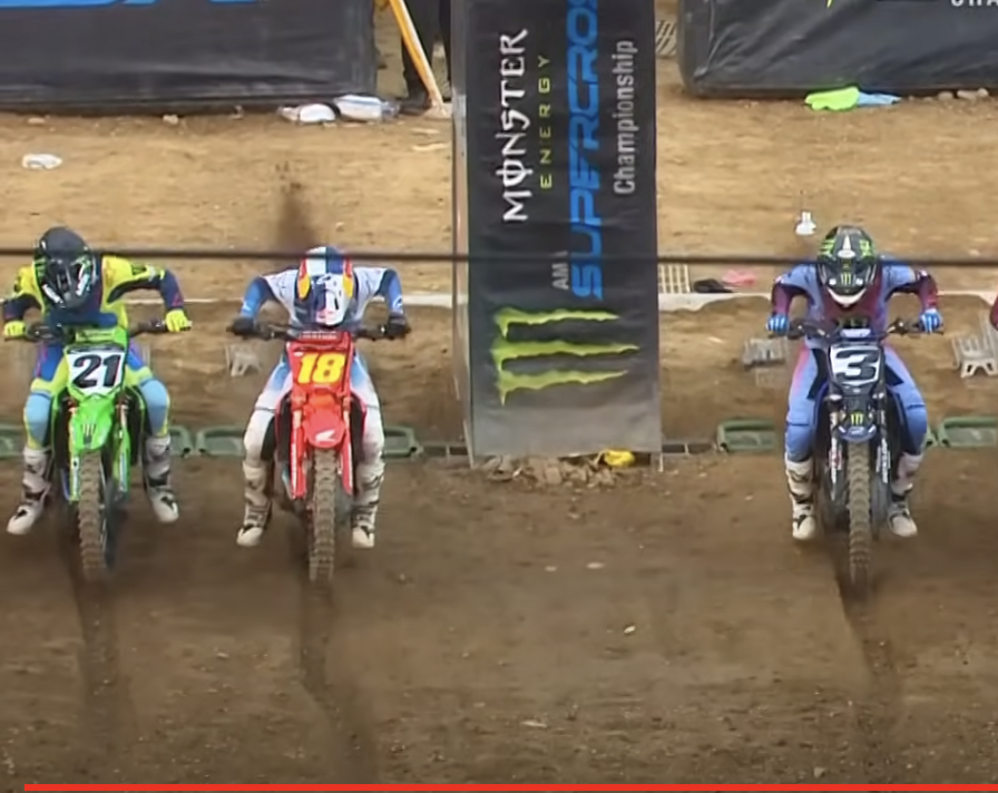 Jett Lawrence picked the same gate as Deegan, but got his elbows ahead of Jason Anderson (21) on his right. Note the weird part of the rut up ahead, though.