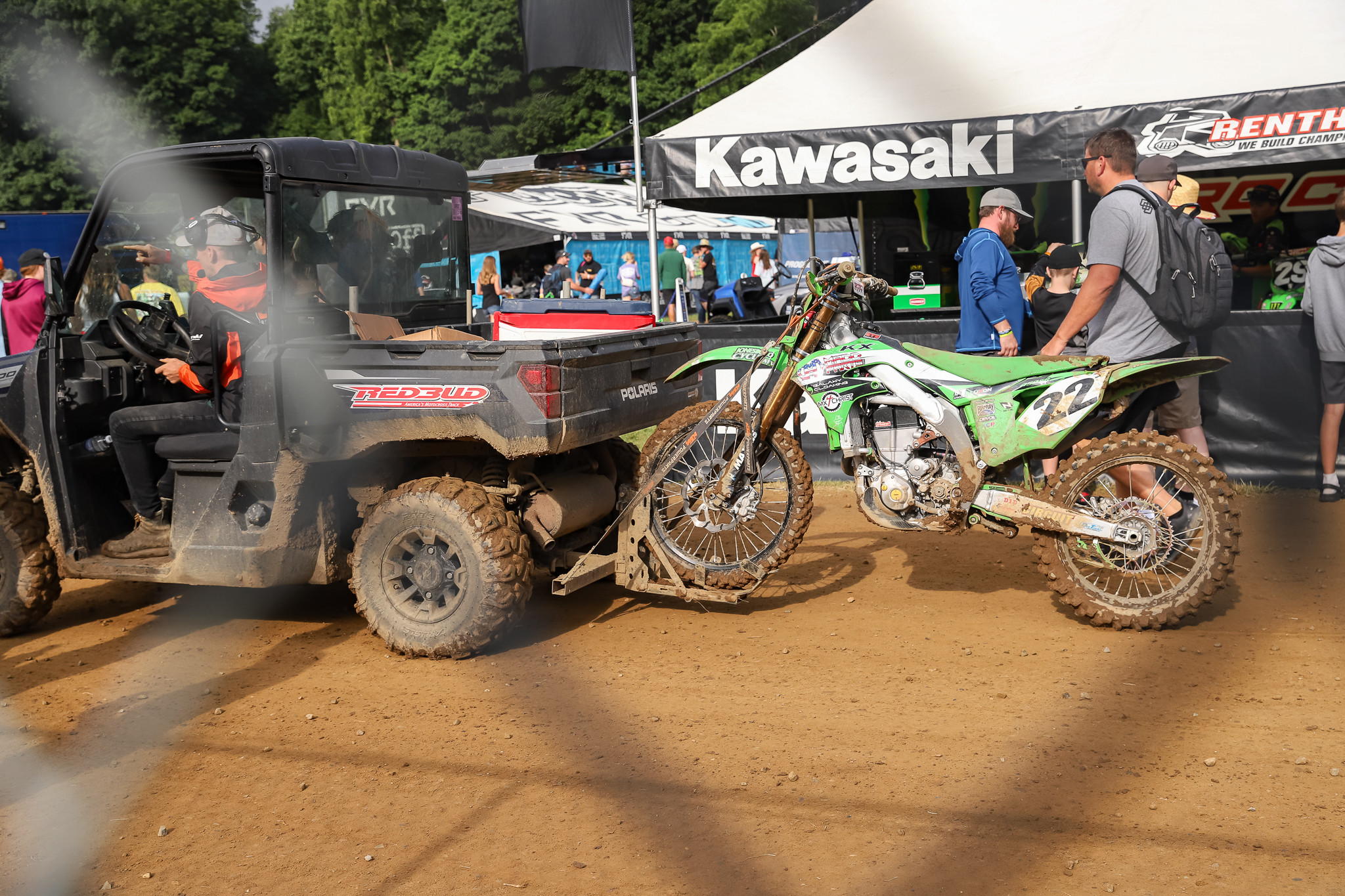  Fredrik Noren's Kawasaki KX450 being carted off after he blew out spokes on his rear wheel.