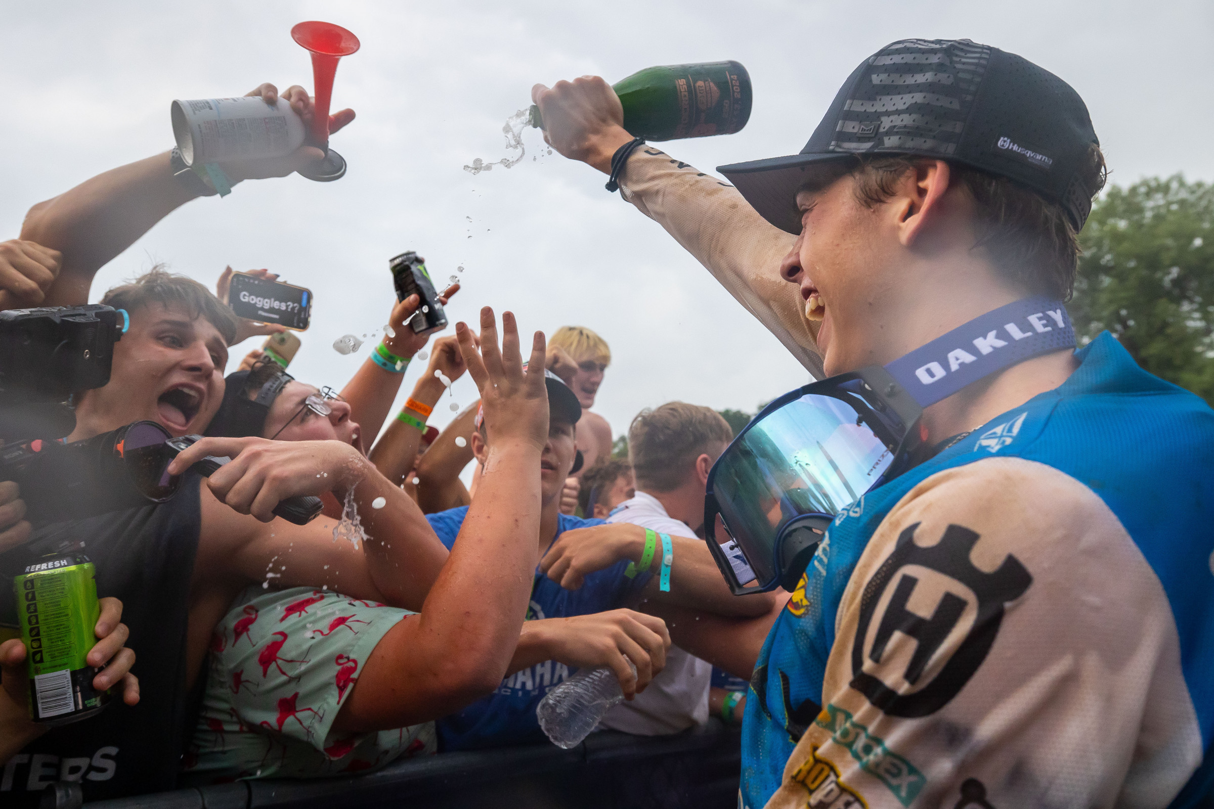 Casey Cochran showering the fans at Spring Creek with champagne, since he is not old enough to drink it himself.