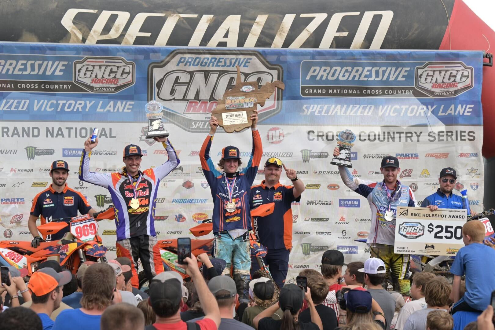 The Buckwheat 100 GNCC overall podium: Grant Davis (center, KTM, XC2), Johnny Girroir (left, KTM, X1 winner), and Liam Draper (right, Yamaha, XC1).