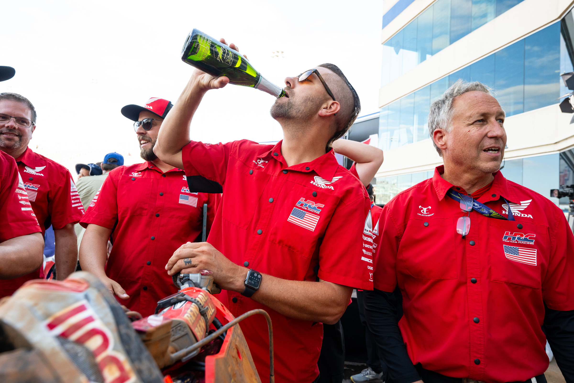 Lars Lindstrom celebrating Jett Lawrence's win at the first round of the SMX Playoffs.