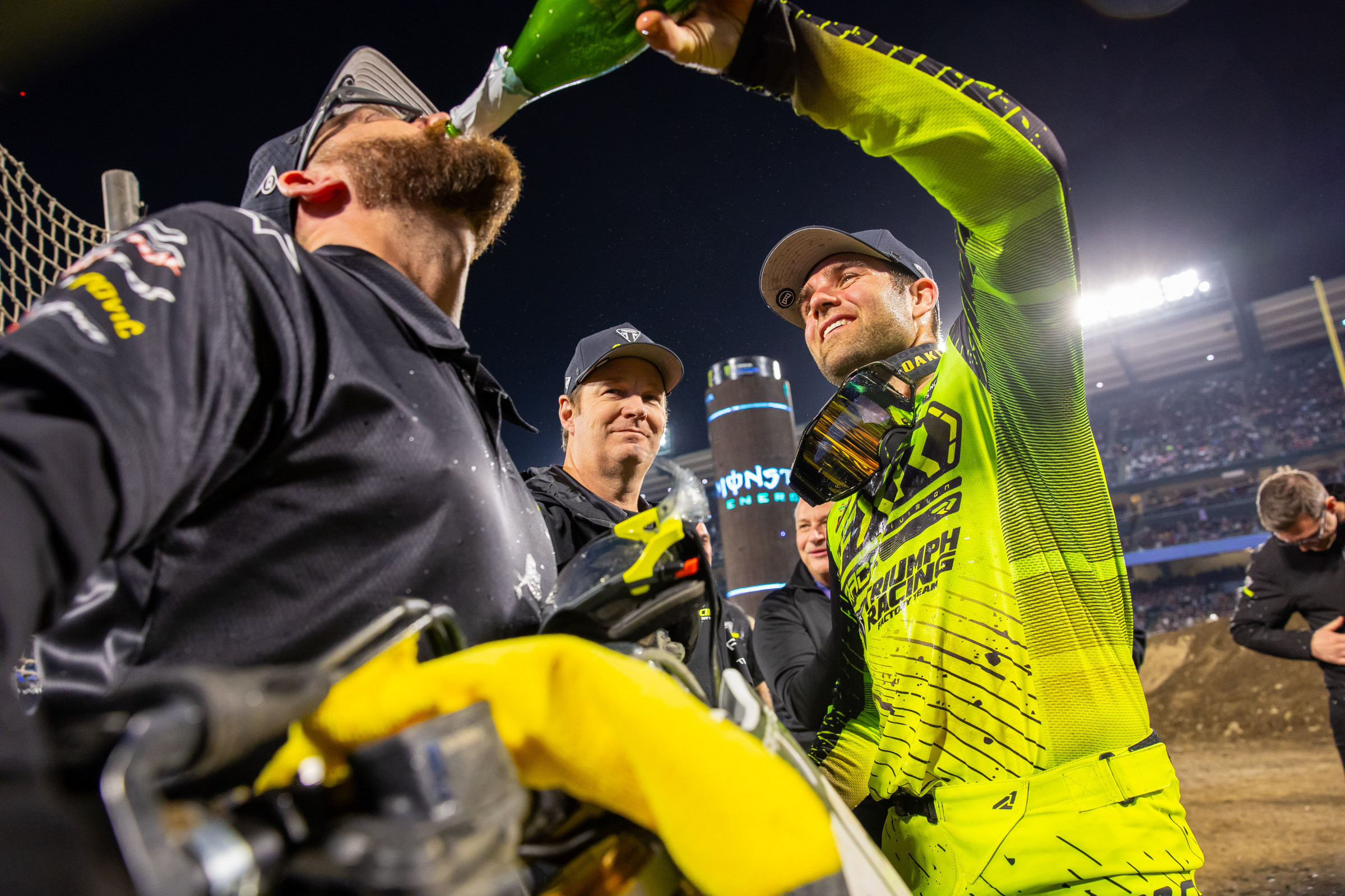 Jordon Smith pours some champagne for his mechanic Justin Hopson.