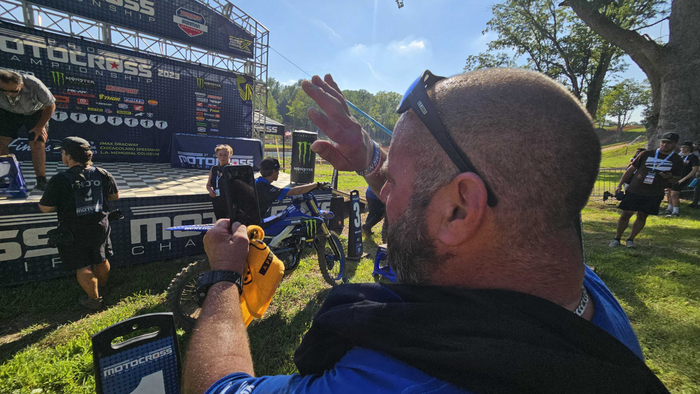 Kevin Towers facetiming the '23 Ironman Moto Combine podium celebration to family.