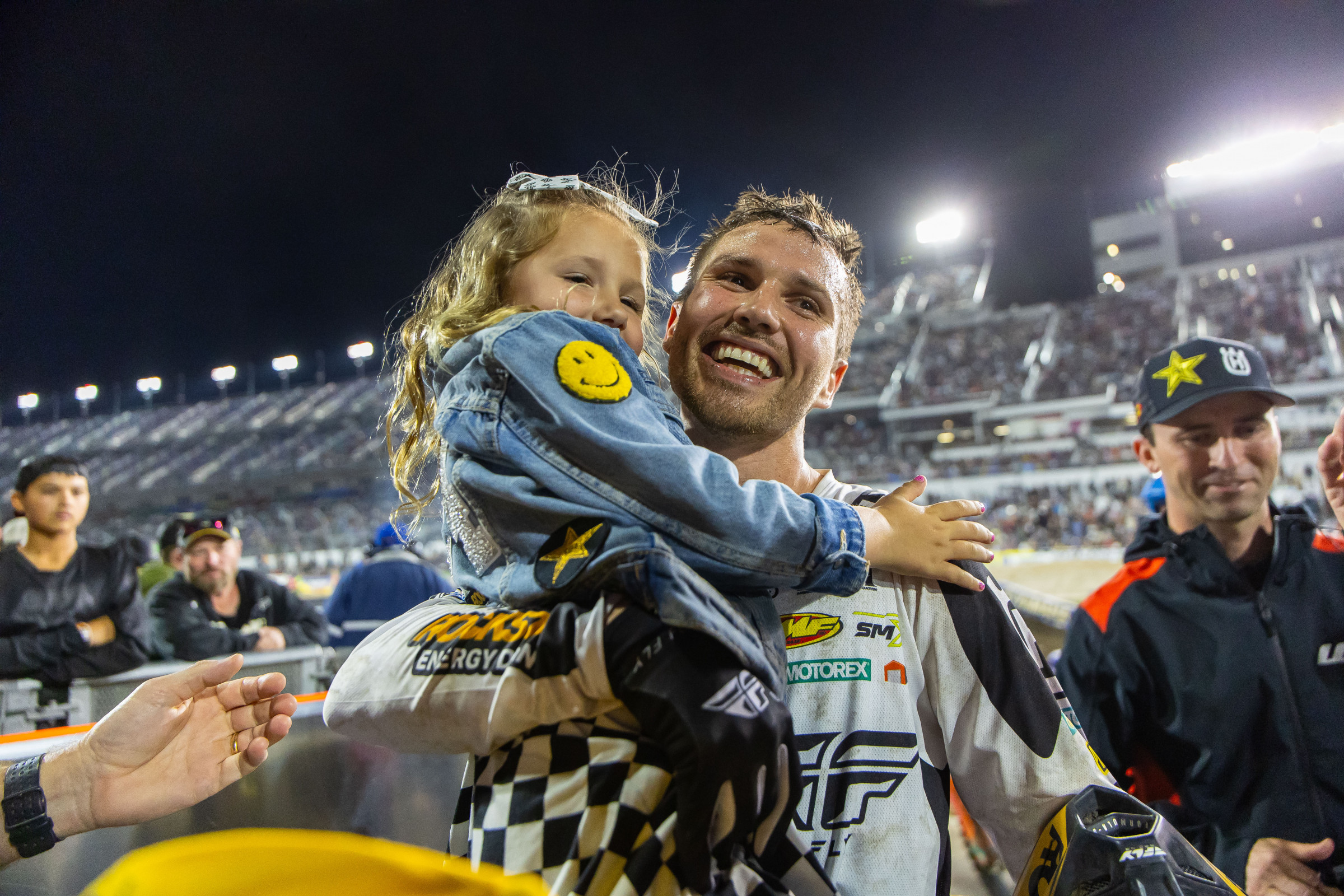 RJ Hampshire celebrates with one of his daughters.