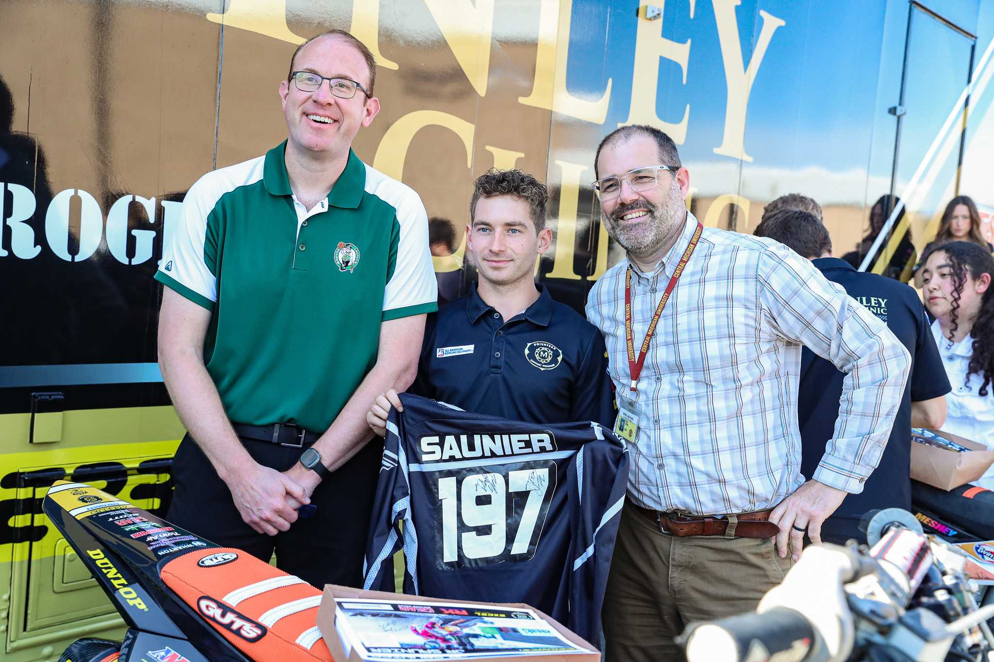 Brian Saunier Jr. with school faculty.