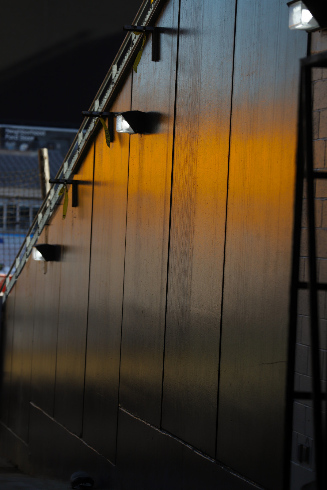 The golden seats reflect in the tunnel at Acrisure Stadium.