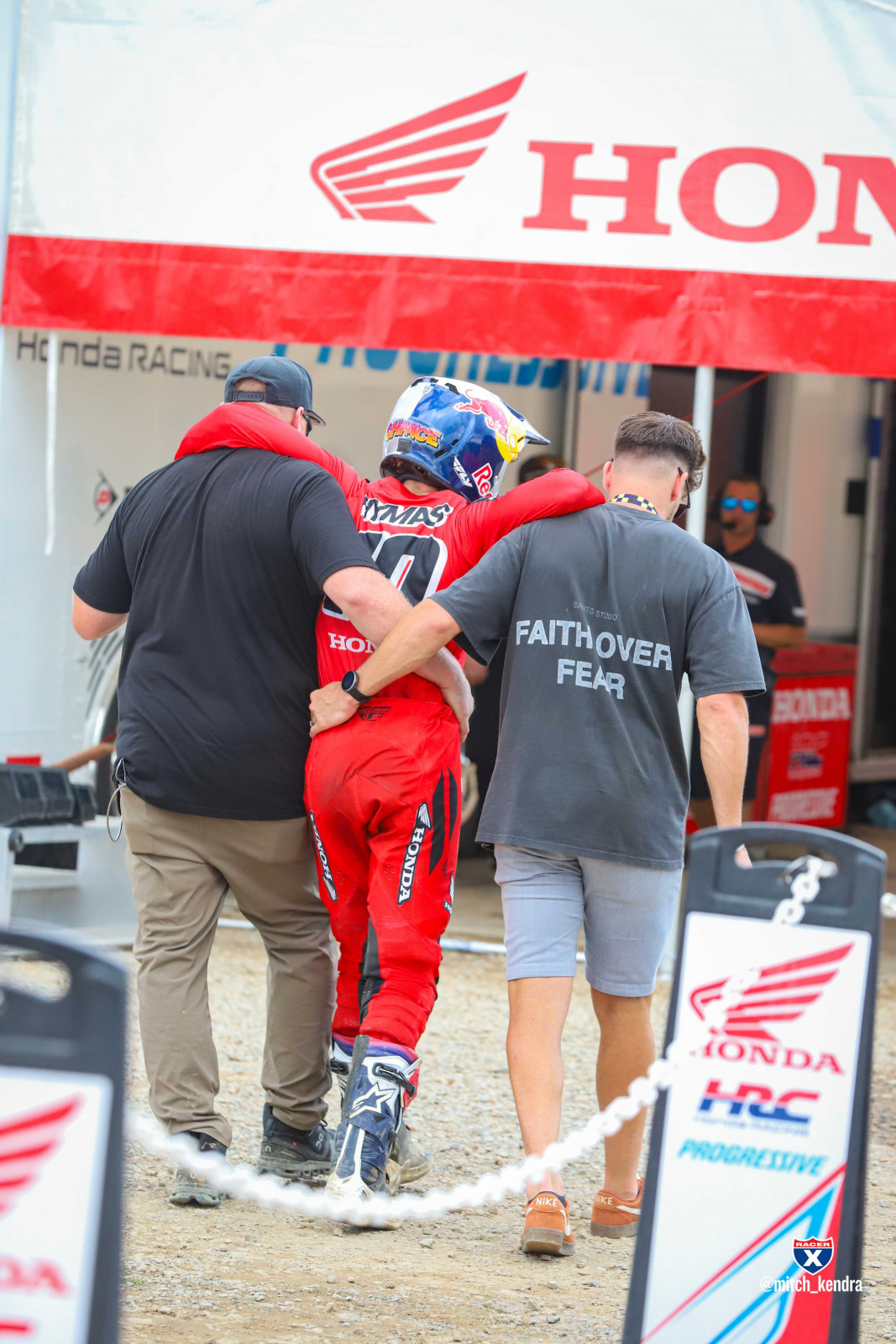 Hymas limping to the Honda truck after dabbing his knee on the final lap of the second 250 Class moto.