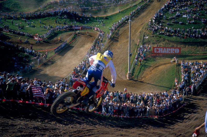 '86 des Nations drop-off. This particular jump was really fun. It was an awesome view and one of the rare places in racing where you just look out at the crowd for a second and really appreciate the moment. I went pretty close to the fence on my right to miss some bumps once and the fans touched me. I changed my line more to the left after that!