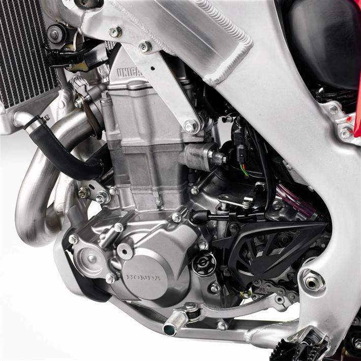 The all-new engine can now spin to 11,450 rpm and puts out a claimed 56.3 bhp at 8500 rpm along with 37.5 lb./ft. of torque at 7000 rpm. The engine is shorter and narrower than it used to be, which saves weight while simultaneously lowering the center of mass for better handling.