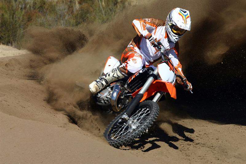 As I sat there at Cahuilla Creek MX Park staring at the new bikes I knew I couldn’t break down and ride them. Years of overcoming my craving for the light, snappy machines would be lost as soon as I revved the throttle. So I sent my friend Tyler Kalisiak out instead while I diverted my attention by shooting pictures. Tyler was a very fast up-and-coming pro rider who now works for Truth Soul Armor clothing. He hadn’t been on a two-stroke in a long time and he was anxious to get out on the brand new layout at Cahuilla Creek. 