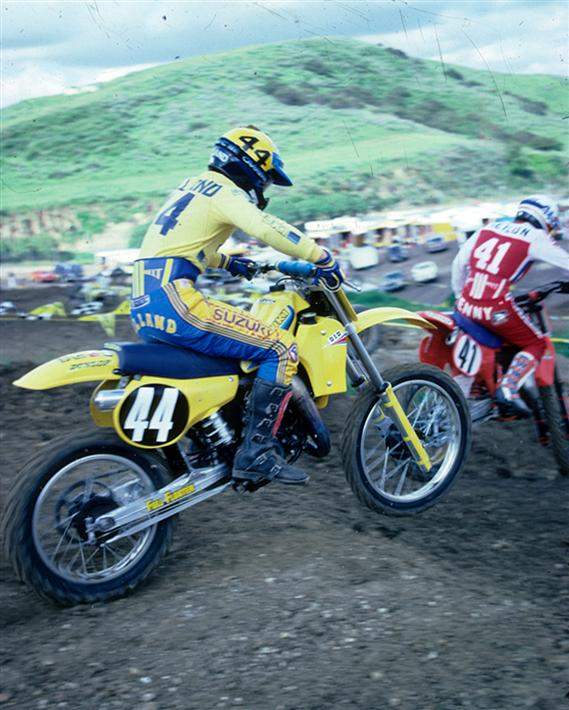 This is a cool shot of George Holland riding what must be practice with Kenny Keylon. We know it was taken in 1982, because that was the year Keylon won the ’82 St. Petersburg National wearing #41. “The Almond Farmer,” as Holland was known by, is riding an RM125 Full Floater, while Kenny is on a CR250.