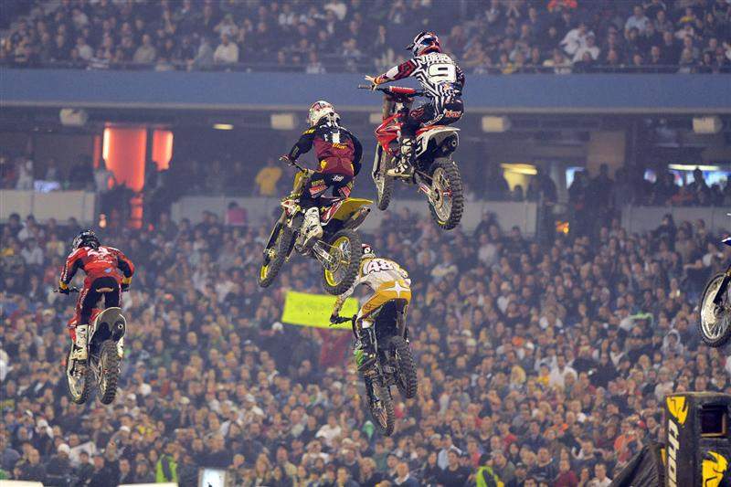 While James Stewart made quick work of Mike Alessi out front, Chad Reed (1) had to fight his way through some riders.