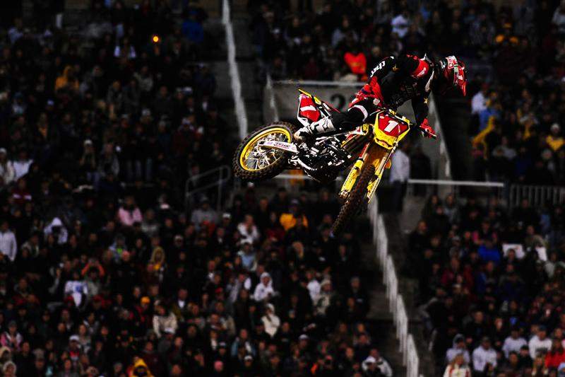 Chad Reed (1) grabbed the holeshot and checked behind him off the track's second triple, finding James Stewart right there.