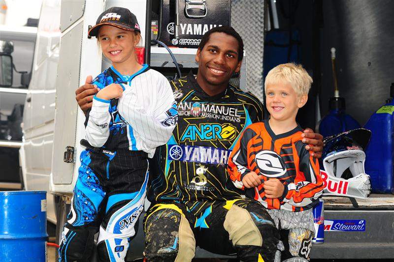 James Stewart poses with a couple fans at his JS7 ride day.