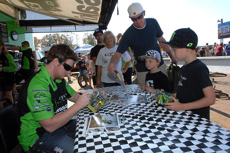 Villopoto signs autographs for fans.