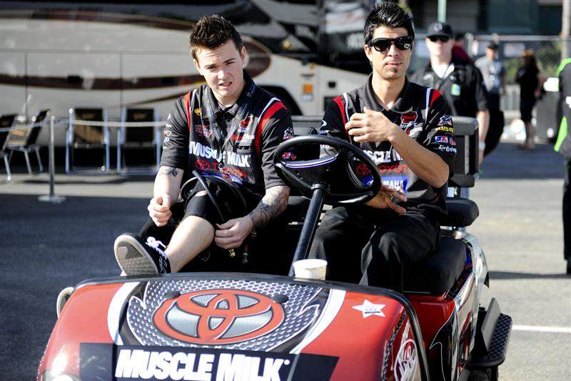 Josh Grant and his mechanic Alex Ewing head down for the track walk. The brace on Grant's knee is to support it from the crash he had in Brisbane a month ago or so.