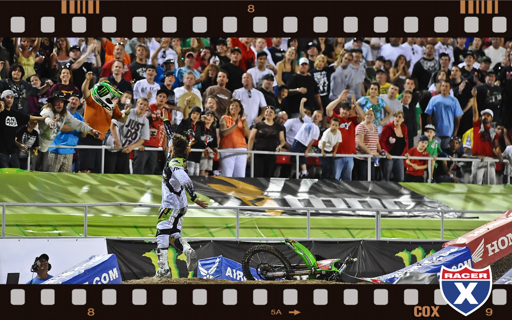 Christophe Pourcel throws his helmet to the crowd after his last ever Lites SX race.