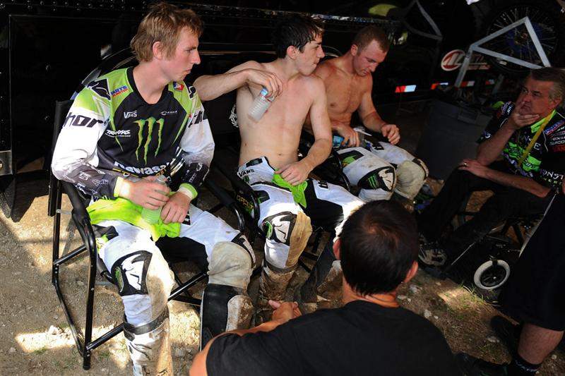 The Monster Energy/Pro Circuit Kawasaki team of Jake Weimer (left), Dean Wilson (middle) and Tyla Rattray (right) check in with Mitch Payton (far right) and Randy Lawrence (foreground) in the PC pits.