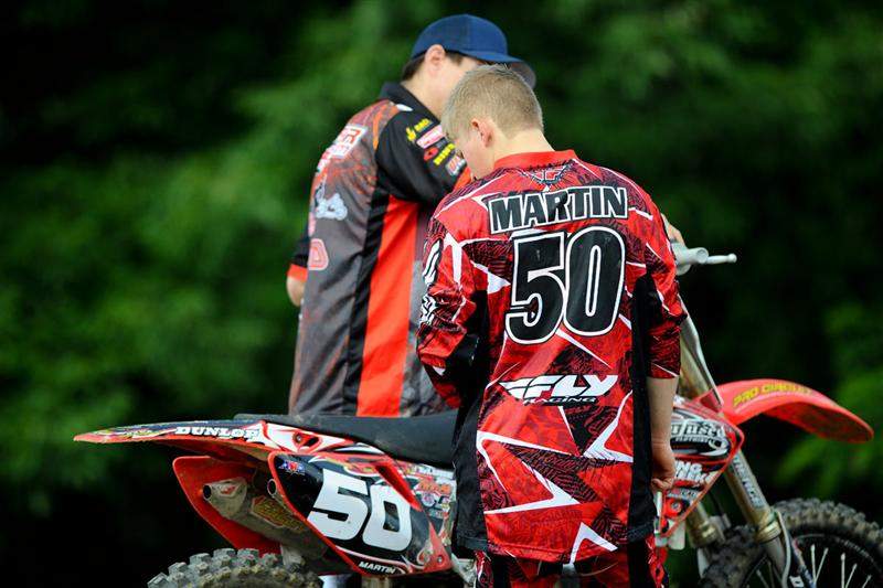 Alex Martin discussing settings with his mechanic.