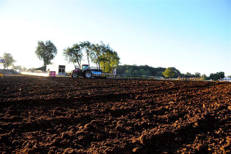 A tractor tills up the start straightaway at legendary RedBud Raceway.