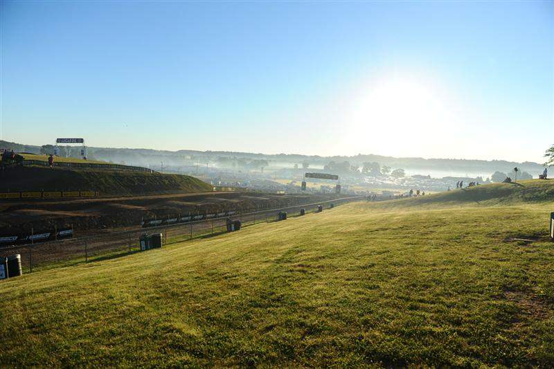 The sun coming up over the camps, bringing light in on the front side of the track.