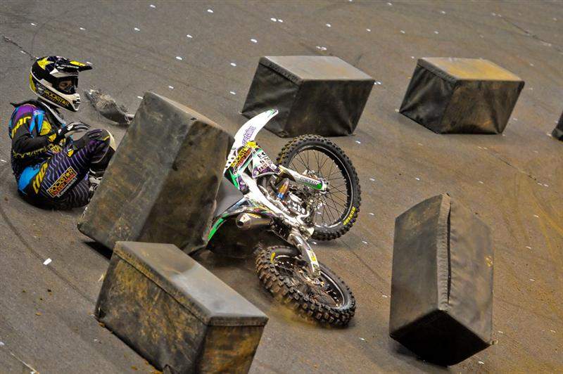 ...Stenberg fell. He was slow to get up, but he did get up, and only a lap later, Faisst stalled his bike, giving Stenberg the lead back.