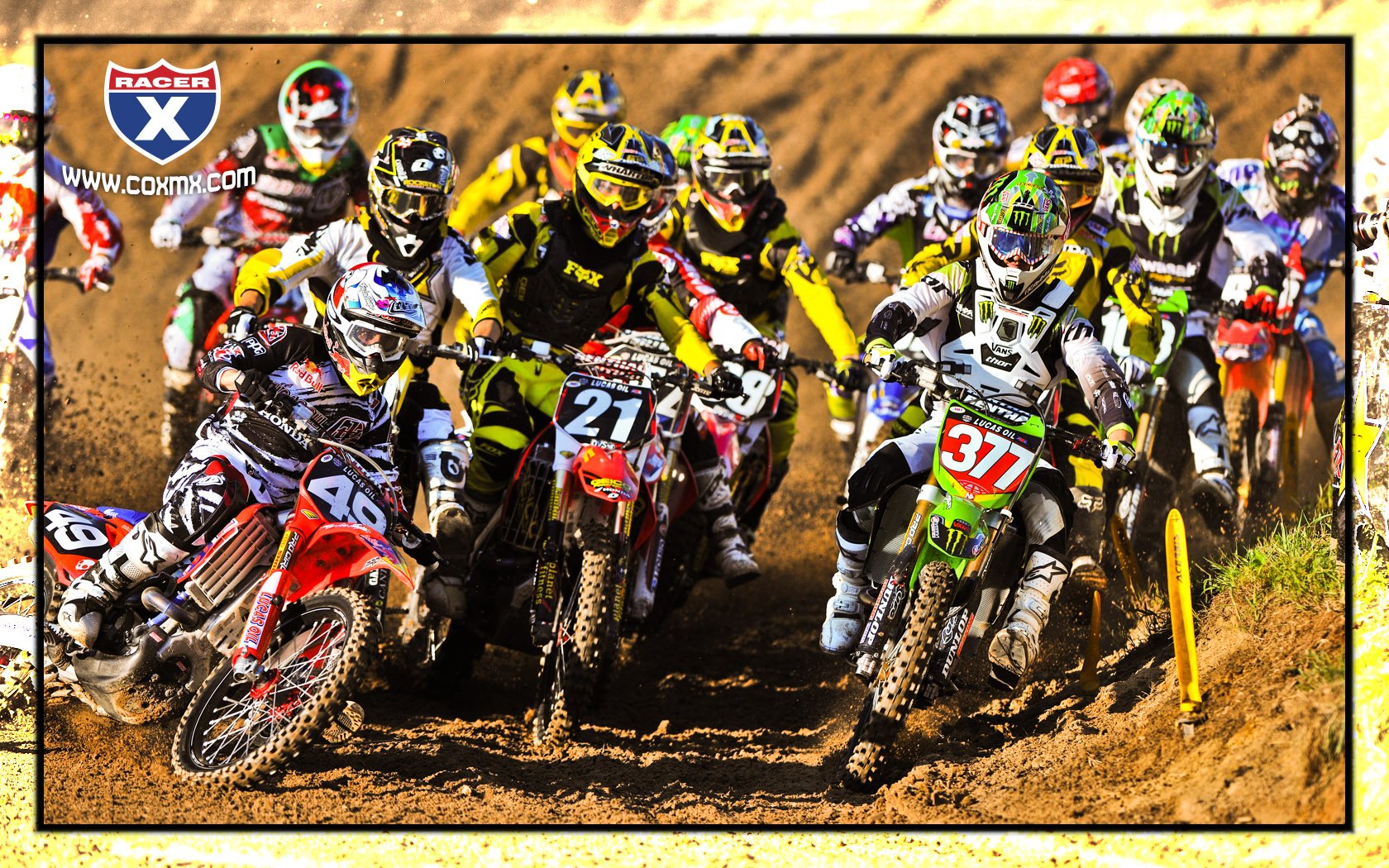 Wil Hahn (49) swoops across to grab the holeshot from Chris Pourcel (377).