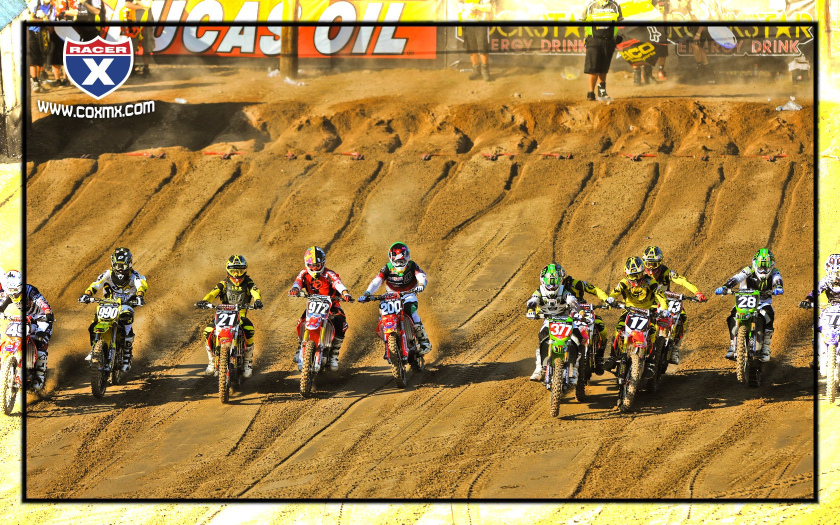 Chris Pourcel (377) cuts across in front of Trey Canard (38) and the rest of the field at the start of moto two.