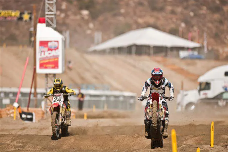 Trey Canard leads his teammate Brett Metcalfe through the sand whoops at Pala.