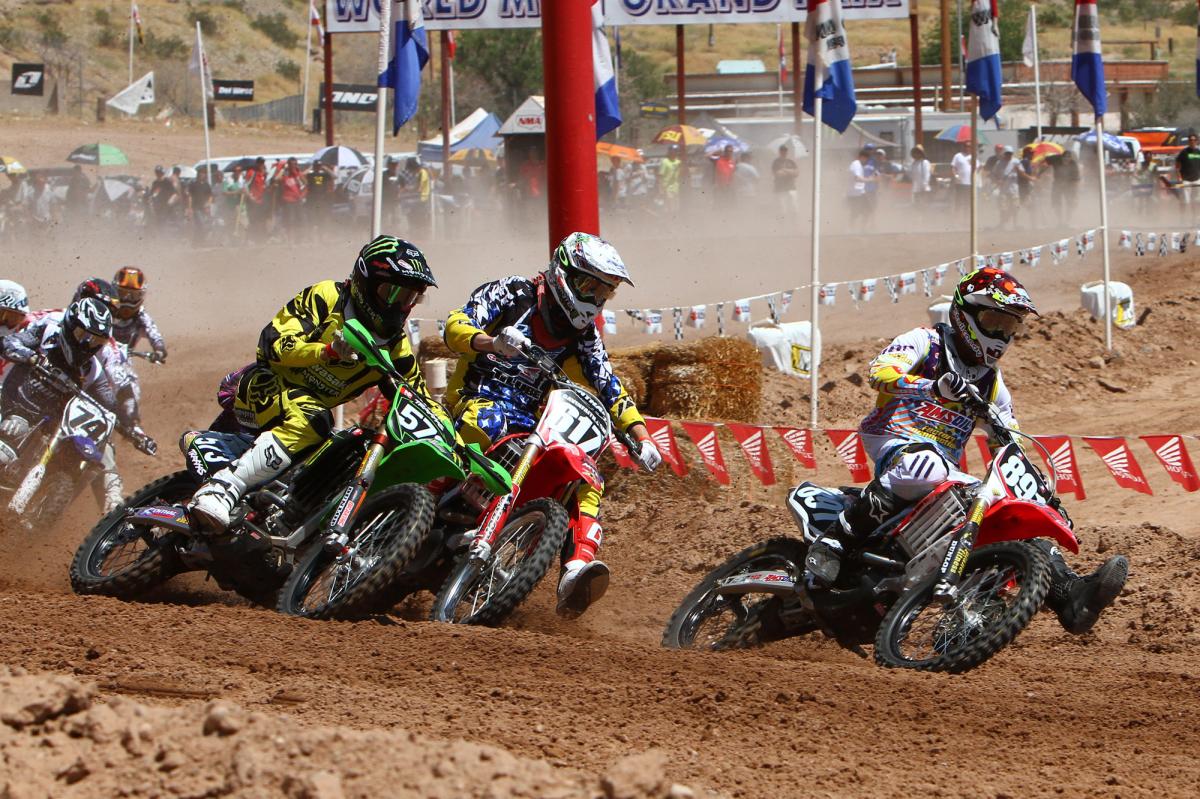 Future Star Justin Bogle (891) leds Gavin Faith (617) and Jacob Hayes (573) into the first turn. Bogle won championships in the 250 Stk. Pro and 250 Mod. Pro classes, and took second in the 450 Stk. Pro class. Whiskey throttle, and an ensuing crash and DNF in the second moto of the 450 Mod. Pro class ruined Bogles bid for a third championship.