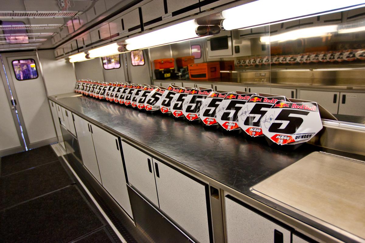 Signed RD number plates. Gifts for the media, courtesy of Red Bull/KTM