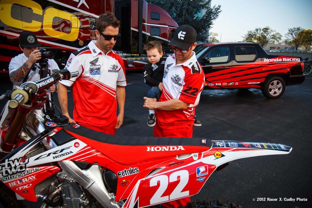 Tate checks out his dad's red plates